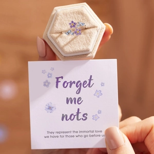 S925 sterling silver forget-me-not flower ring with purple gems in a beige gift box