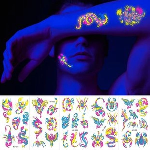 Glow-in-the-dark fluorescent temporary tattoos featuring dragon, spider, and scorpion patterns