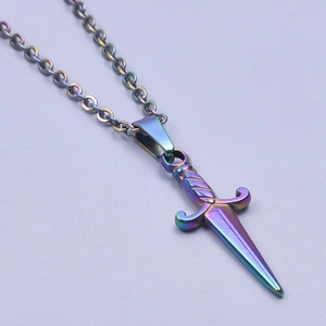 Macro shot of iridescent dagger pendant in rainbow finish with simple steel chain
