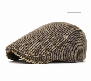 Close-up of vintage vertical rib knit texture on brown tie-dye winter flat cap