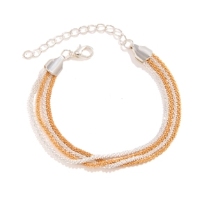 Detail of layered gold and silver twisted wire bracelet with lobster clasp closure