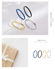 Detail view of slim minimalist rings in dark blue, black, gold, and silver finishes