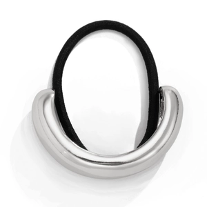 Macro view of silver U-shaped metal accessory on a black elastic hair tie with glossy finish