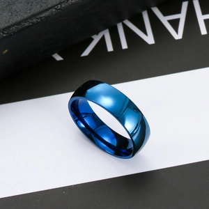 Polished blue stainless steel ring with mirror finish on high-contrast background