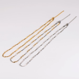 Minimalist gold and silver snake chain necklaces in layered sleek twisted styles