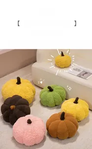 Detail of plush pumpkin pillows in various colors showing soft teddy fleece fabric texture
