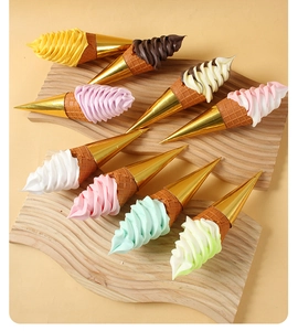 Detailed overhead view of nine assorted artificial ice cream cones on wooden boards