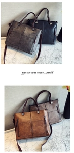 Detail view of large retro tote bags in four colors on a marble surface with zip pockets