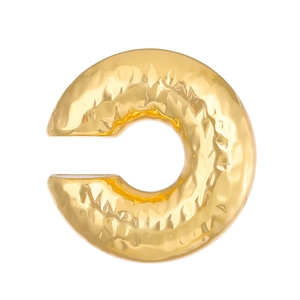 Close-up of golden C-shaped ear cuff with unique hammered texture and metallic finish