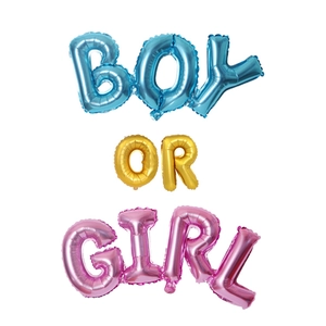 Blue, gold and pink foil balloons spelling BOY OR GIRL for gender reveal party decor