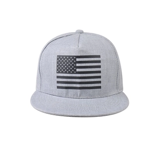 Detail of grey flat brim snapback hat featuring black American flag embroidery detail