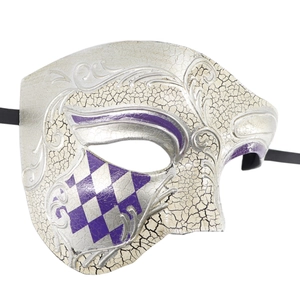 Close-up of silver masquerade mask with purple checkerboard and crackle texture