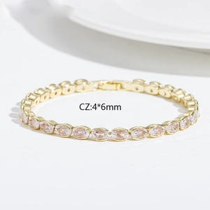 Detail showing 4x6mm oval cubic zirconia stones on a gold-plated tennis bracelet