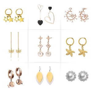 Detailed assortment of nine unique gold and silver earrings with pearl and floral charms