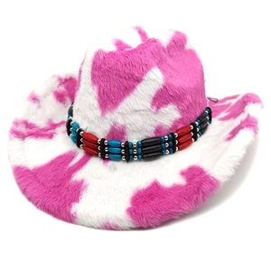 Detail of pink cow print plush cowboy hat with colorful beaded decorative band