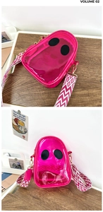Detail view of pink transparent PVC jelly bag with unique eyes and woven strap