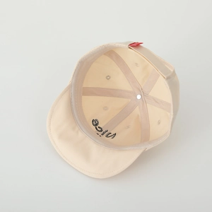 Detail view of cotton baby cap interior stitching and nice embroidery on soft brim