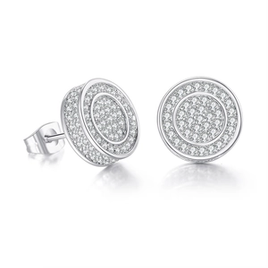 Macro shot of silver hip hop stud earrings featuring pave-set iced out cubic zirconia
