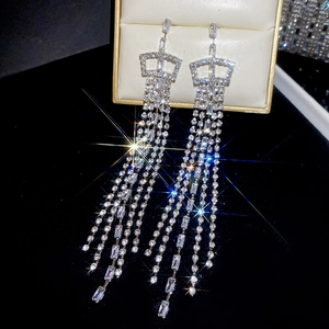 Detail view of silver square tassel earrings with sparkling white cubic zirconia stones