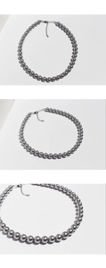 Detailed view of silver grey pearl necklace with metallic clasp and adjustable extension chain