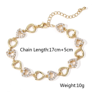 Detail of gold-plated heart bracelet with white zircon pavé and lobster clasp