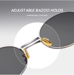 Detailed macro view of adjustable yellow nose pads on steampunk metal sunglasses
