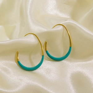 Minimalist 14K gold plated stainless steel hook earrings with green enamel and silk backdrop