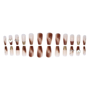 Long coffin press-on nails with mocha marble gradient, gold foil, and heart crystal accents
