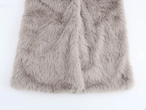 Detailed close-up showing soft texture and high-quality gray faux fur coat hemline