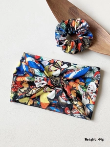 Detail view of colorful butterfly print headband and scrunchie set weighing 44 grams