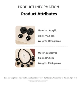 Detailed view of black acrylic beaded necklace and heart-shaped earring set with measurements