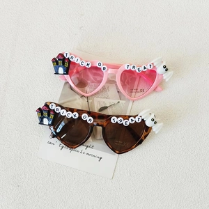 Halloween heart sunglasses for girls featuring Trick or Treat letters and UV400 protection