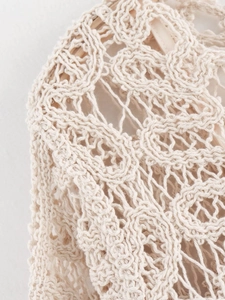 Vue macro détaillée du motif de dentelle au crochet beige et de la texture coton