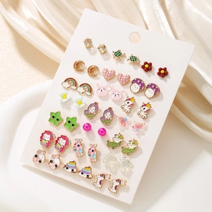 Set of colorful cartoon enamel stud earrings featuring unicorn and rainbow designs