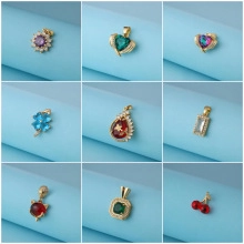 Detailed grid showing multi-colored zircon pendants in heart and clover shapes