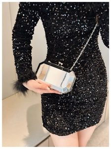 Silver geometric evening clutch with chain strap shown on black sequin dress