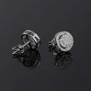 Macro view of silver hip-hop earrings with micro-paved zircons and butterfly backs