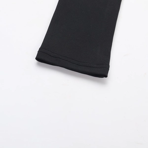 Detailed close-up of double-needle stitching on black elastic fabric sleeve cuffs