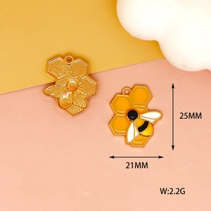 Macro detail of bee charms with dimensions 25x21mm showing enamel and metal finish