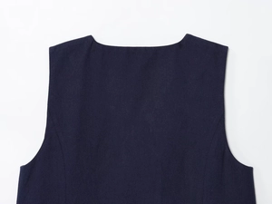Detail of navy blue sleeveless top showing high-quality twill fabric texture and neckline