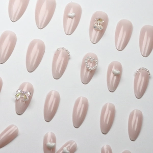 French press-on nails for kids with 3D bears, pearls, and bows in elegant nude pink
