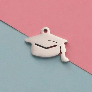 Polished silver stainless steel graduation cap pendant on a pink and blue background