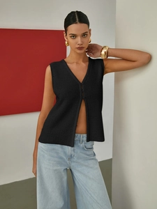 Women's black hollow knit vest with V-neck and single button detail in modern style