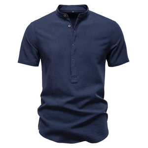 Detail of navy blue cotton linen shirt showing textured waffle fabric and buttons