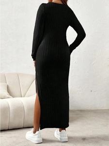Slim fit black maternity knit dress with long sleeves and elegant side slit detail