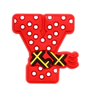 Detail of red PVC letter Y shoe charm with decorative patterns for clog shoe customization