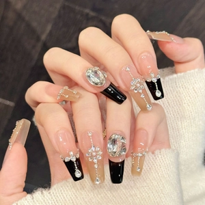 Luxurious long coffin press-on nails with black and pink crystals and dangling tassels