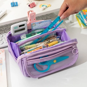 Detailed view of spacious purple pencil case with organized stationery and clear front pocket