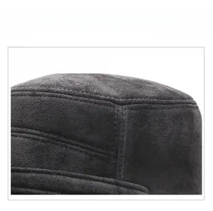 Detail shot of black suede trapper hat with reinforced double-needle stitching and seams