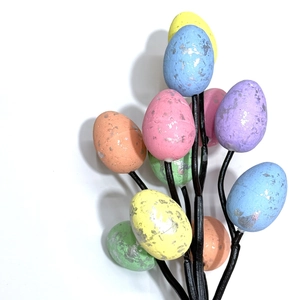 Easter egg tree bouquet with colorful speckled eggs on black branches for home decor